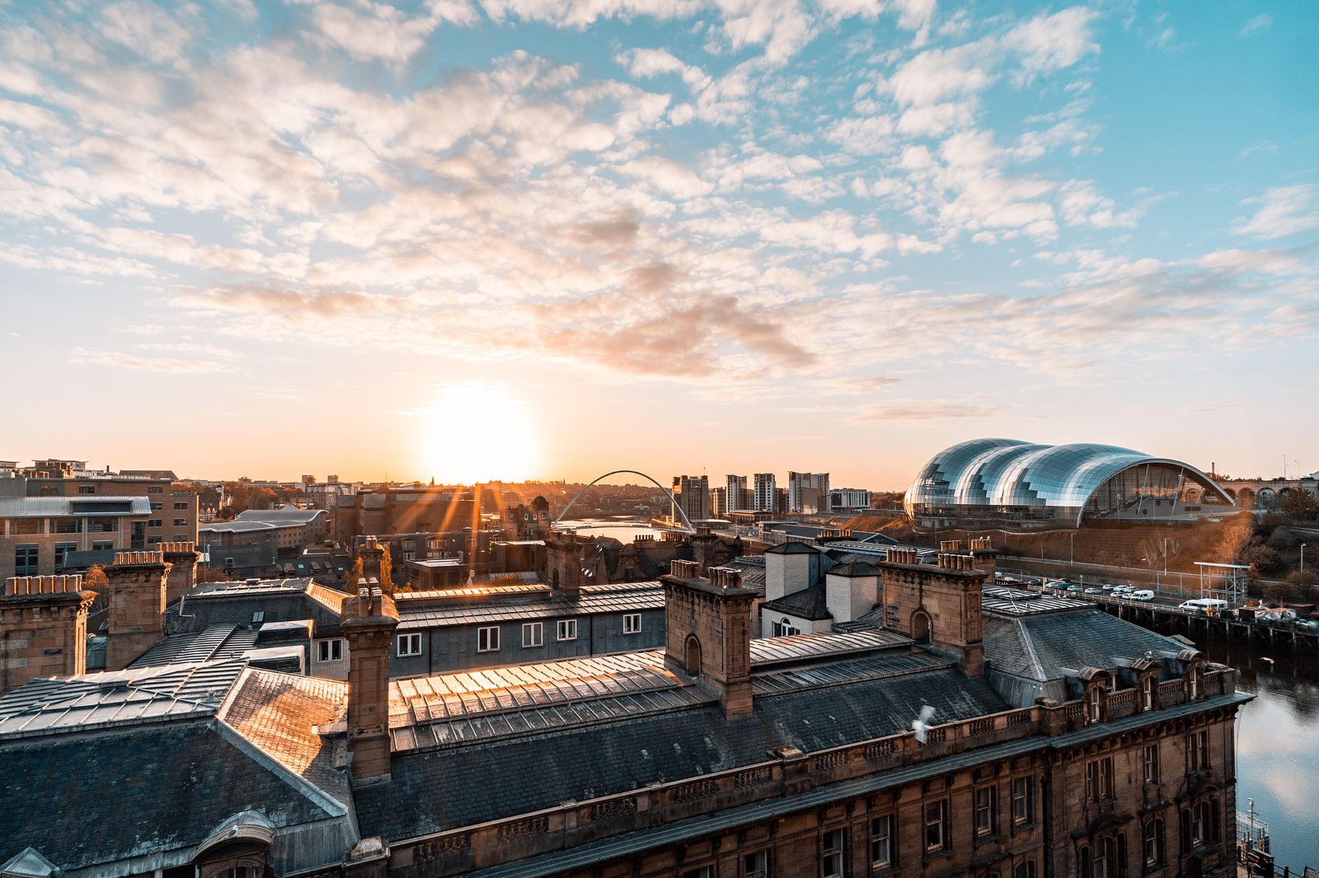 Newcastle upon Tyne skyline at sunrise.