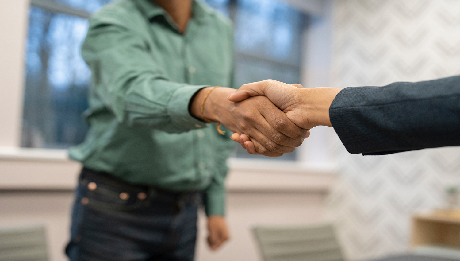 Handshake symbolising agreement and resolution between two parties.